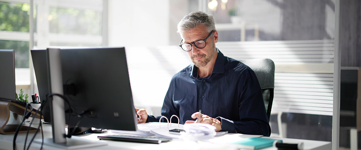 An accountant reading about changes to the tax treatment of carried interest
