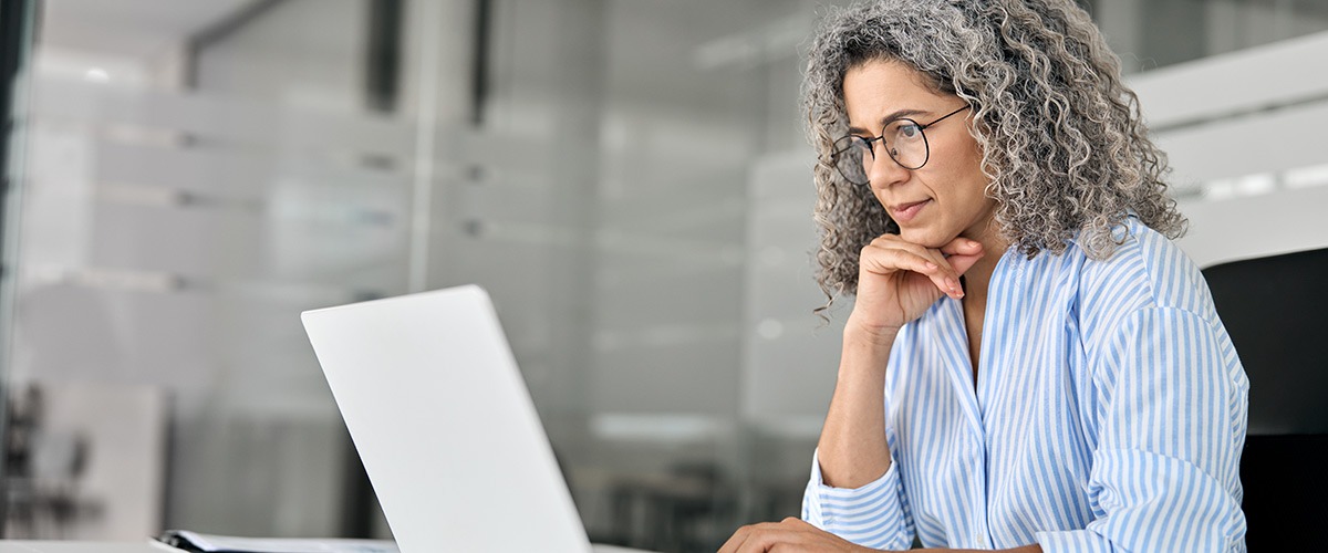 A woman is reading about trust registration changes