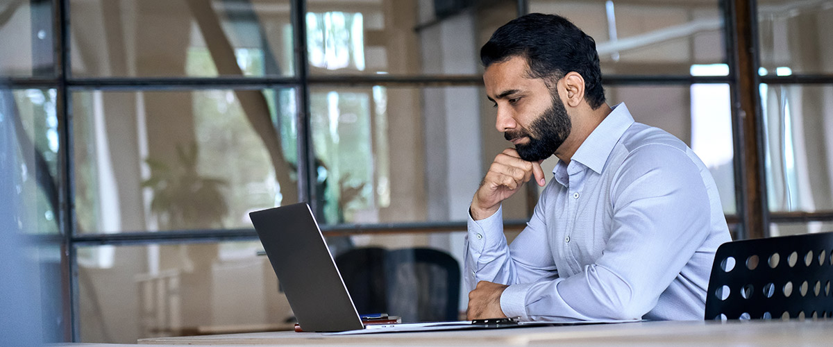 A professional reading information about the transaction services consultation