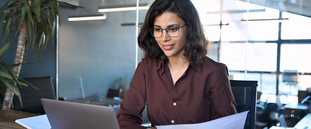 A professional woman looking at the Trust Registration Service information